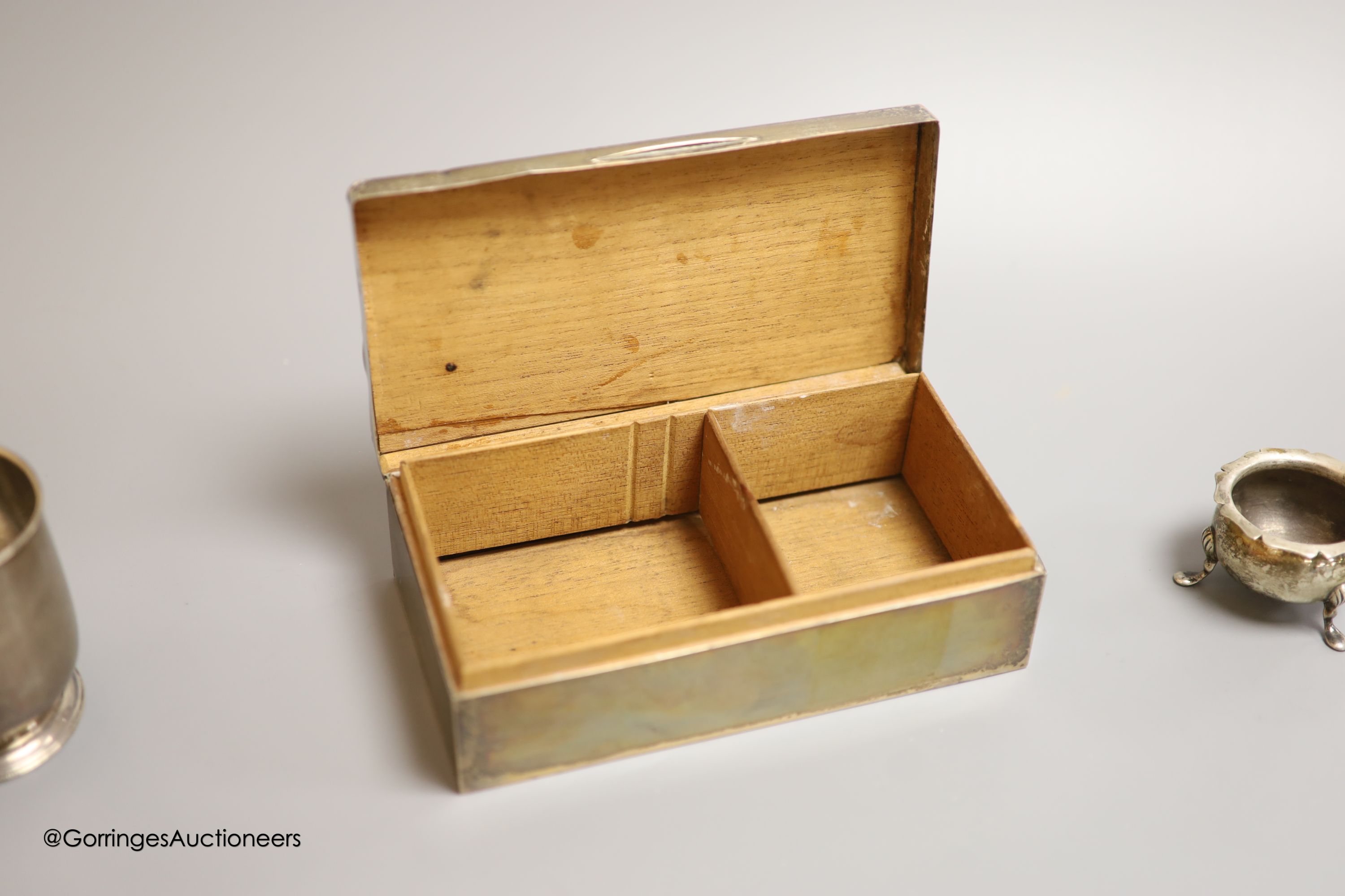 A George V silver rectangular cigarette box, Birmingham, 1926,16.5cm, a silver christening mug and a silver salt.